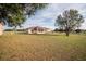 Large backyard with a screened porch and plenty of green space at 8243 Alturas Rd, Bartow, FL 33830