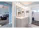 Bathroom with double vanity and updated light fixtures at 8243 Alturas Rd, Bartow, FL 33830