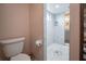 Guest bathroom with toilet and view of walk-in shower at 8243 Alturas Rd, Bartow, FL 33830