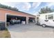 Three-car garage with additional space for storage; food truck visible at 8243 Alturas Rd, Bartow, FL 33830