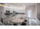 Modern kitchen with white cabinets, granite countertops, and breakfast bar at 8243 Alturas Rd, Bartow, FL 33830
