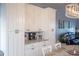 White kitchen cabinets and granite countertops at 8243 Alturas Rd, Bartow, FL 33830