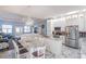 Open concept kitchen with island, white cabinets, and granite countertops at 8243 Alturas Rd, Bartow, FL 33830