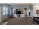 Living room features a built-in entertainment center and neutral decor at 8243 Alturas Rd, Bartow, FL 33830