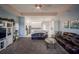 Spacious living room with leather couches and a large TV at 8243 Alturas Rd, Bartow, FL 33830