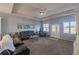 Spacious living room with comfortable seating and neutral carpeting at 8243 Alturas Rd, Bartow, FL 33830