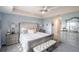 Main bedroom with plush upholstered bed and ample dresser storage at 8243 Alturas Rd, Bartow, FL 33830
