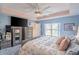 Main bedroom with king-size bed and large window overlooking the backyard at 8243 Alturas Rd, Bartow, FL 33830