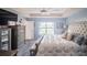 King-size bed, large window, and neutral color palette in this main bedroom at 8243 Alturas Rd, Bartow, FL 33830