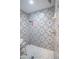 Walk-in shower with patterned tile and hexagon floor tile at 8243 Alturas Rd, Bartow, FL 33830
