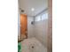 Large walk-in shower with patterned tile and bench at 8243 Alturas Rd, Bartow, FL 33830