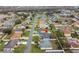 Aerial view of house and surrounding neighborhood at 910 Nancy Ct, Kissimmee, FL 34759