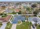 Aerial view showing a single-Gathering home with solar panels and a large backyard at 910 Nancy Ct, Kissimmee, FL 34759