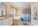 Bathroom with garden tub and double sinks at 910 Nancy Ct, Kissimmee, FL 34759