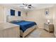 Main bedroom with large bed and dresser at 910 Nancy Ct, Kissimmee, FL 34759