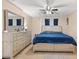 Main bedroom with large bed and dresser at 910 Nancy Ct, Kissimmee, FL 34759