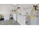 Convenient laundry room with washer, dryer, and extra refrigerator at 910 Nancy Ct, Kissimmee, FL 34759