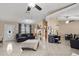 Open living area with multiple seating areas and tile floors at 910 Nancy Ct, Kissimmee, FL 34759
