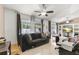Spacious living room with tile floors and ceiling fan at 910 Nancy Ct, Kissimmee, FL 34759