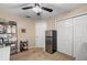 Well-lit spare room with refrigerator, shelving, and ample closet space at 910 Nancy Ct, Kissimmee, FL 34759