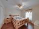 Bedroom with log bed frame and ceiling fan at 9365 Lemon Dr, Lake Wales, FL 33898