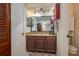 Bathroom with a single vanity and access to the Primary bedroom at 3909 Cypress E Lndg, Winter Haven, FL 33884