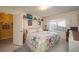 Bedroom with a queen-size bed, tiled floors and built-in shelving at 3909 Cypress E Lndg, Winter Haven, FL 33884