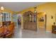 Open dining area with wood table, chairs and a view into the kitchen at 3909 Cypress E Lndg, Winter Haven, FL 33884