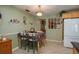 Eat-in kitchen with a green wall and floral table setting at 3909 Cypress E Lndg, Winter Haven, FL 33884