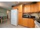 White appliances and light wood cabinets in this eat-in kitchen at 3909 Cypress E Lndg, Winter Haven, FL 33884