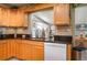 Kitchen with light wood cabinets, granite counters, and white appliances at 3909 Cypress E Lndg, Winter Haven, FL 33884