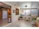 View of kitchen with wood cabinets and stainless steel appliances from sunroom at 3909 Cypress E Lndg, Winter Haven, FL 33884