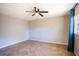 Empty bedroom with tile floor and ceiling fan at 1001 Mockingbird Cir, Winter Haven, FL 33884