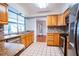 Spacious kitchen with wood cabinets and granite countertops at 1001 Mockingbird Cir, Winter Haven, FL 33884