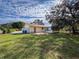 Spacious backyard with large lawn and patio at 1065 8Th St, Winter Haven, FL 33881