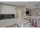 Spacious kitchen with granite countertops and white cabinets at 117 Dinner Lake Ave, Lake Wales, FL 33859