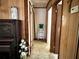 Home hallway with wood paneling and access to other rooms at 1207 Crestwood Dr, Winter Haven, FL 33881