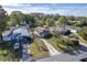 Three houses with driveways, green lawns, and tree cover at 1244 W 9Th St, Lakeland, FL 33805