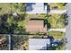Single house with brown roof, driveway, and fenced yard at 1244 W 9Th St, Lakeland, FL 33805