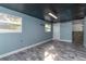 Unfurnished basement with light blue walls and newspaper floor at 1244 W 9Th St, Lakeland, FL 33805