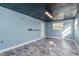 Unfurnished basement room with light blue walls and flooring at 1244 W 9Th St, Lakeland, FL 33805