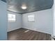 Small bedroom with hardwood floors and two windows at 1244 W 9Th St, Lakeland, FL 33805