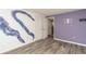 Spacious bedroom with hardwood floors and painted wall at 1244 W 9Th St, Lakeland, FL 33805