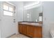 Bathroom boasting a double vanity and a large mirror at 130 Sonja Cir, Davenport, FL 33897