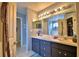 Bathroom with double sinks and a large vanity mirror at 1490 Meadows Pond Dr, Bartow, FL 33830