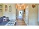 Bright entryway with wood-look floors and a comfortable couch at 1490 Meadows Pond Dr, Bartow, FL 33830