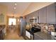 Modern kitchen with stainless steel appliances and granite counters at 1490 Meadows Pond Dr, Bartow, FL 33830