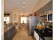 Modern kitchen with stainless steel appliances and granite countertops at 1490 Meadows Pond Dr, Bartow, FL 33830