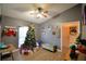 Cozy living room featuring a Christmas tree and decorative accents at 1490 Meadows Pond Dr, Bartow, FL 33830