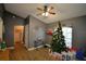 Bright living room with a Christmas tree and access to laundry room at 1490 Meadows Pond Dr, Bartow, FL 33830